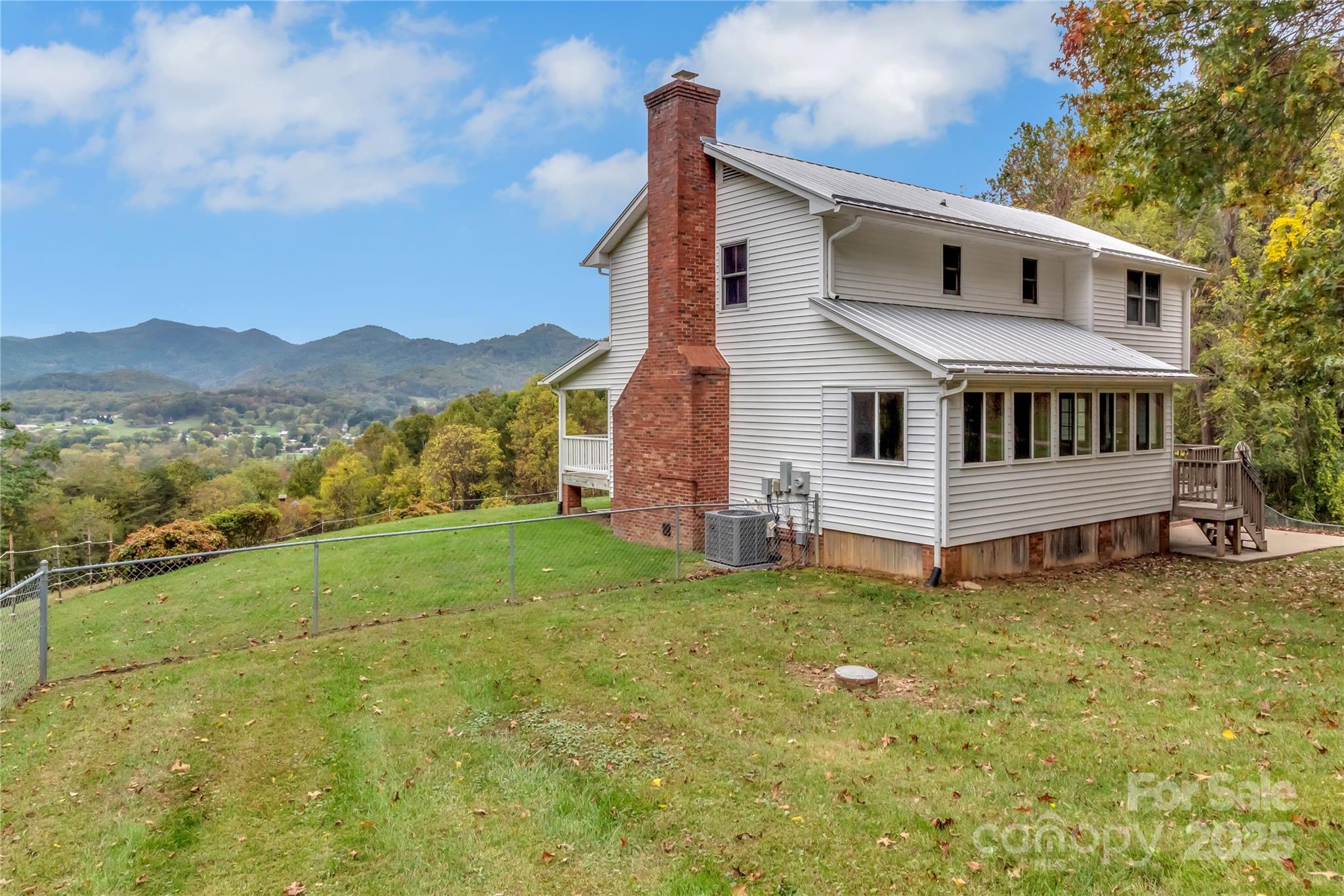 580 River Point Road Canton, NC 28716 - Photo 6 of 46 a view of a house with a yard and a porch