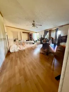 a view of a living room and kitchen