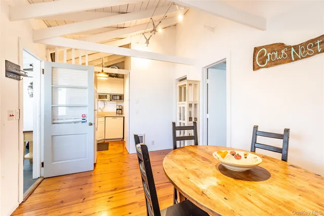 a bedroom with two beds and a window