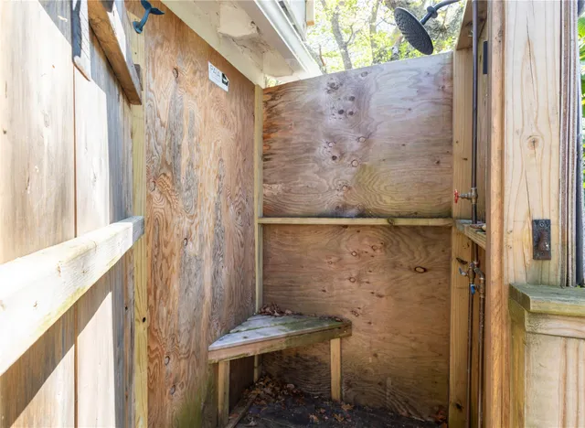 a bathroom with a shower and a sink