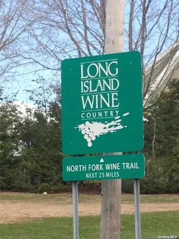 a street sign on a wooden wall