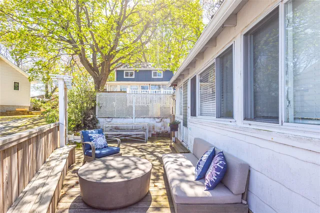 a view of a house with backyard and sitting area