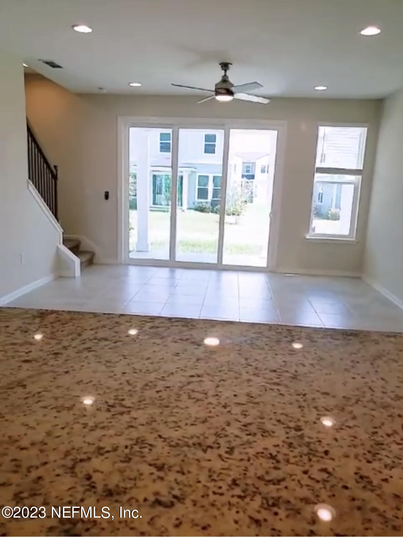 433 Pine Bluff Drive St. Augustine, FL 32092 - Photo 11 of 23 a view of a hallway with wooden floor and chandelier