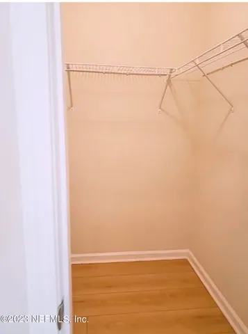 view of hallway with wooden floor