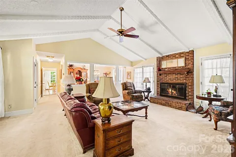 a living room with furniture or fireplace and a chandelier