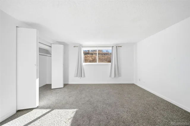 a bathroom with a double vanity sink toilet and mirror