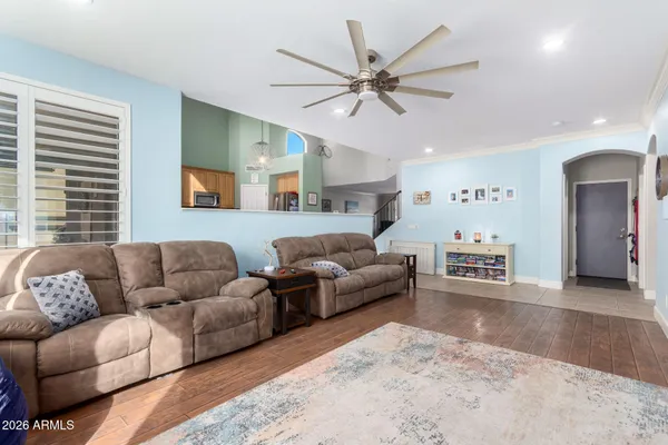 a living room with furniture and a large window