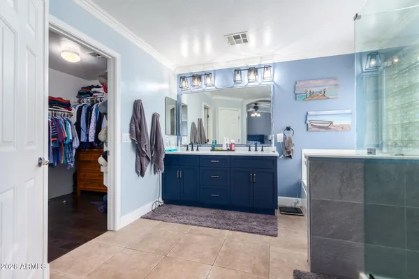 a living room with a large closet and large mirror