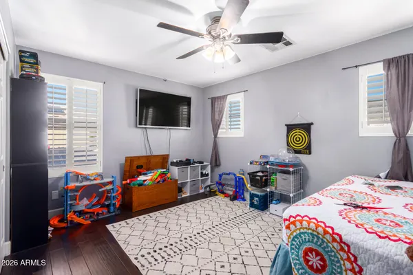 a bedroom with furniture and a book shelf