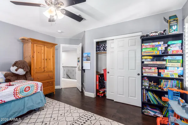 a view of a bathroom with toilet sink and a mirror