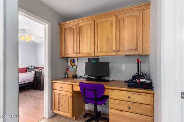 a work room with furniture and a window