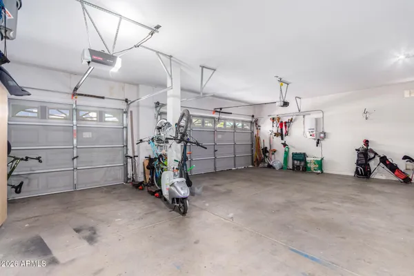 a view of a garage with a bike and car