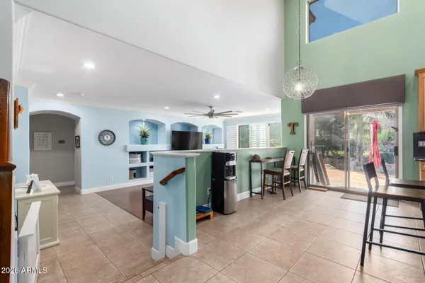 a room with lots of table and chairs