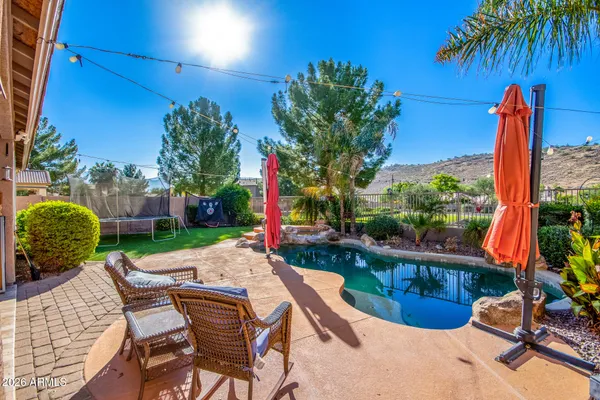 a bed room with furniture and a window