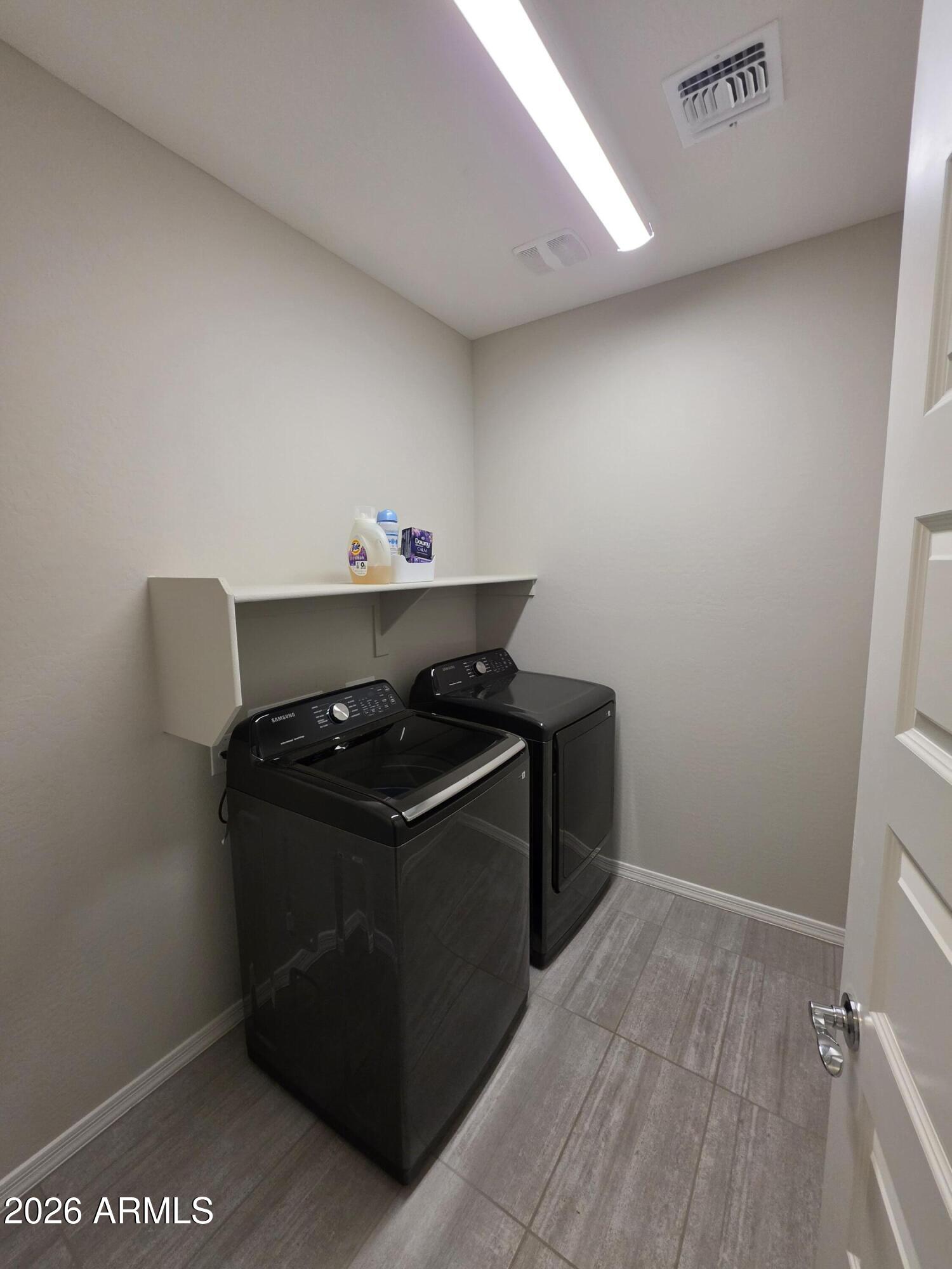 7128 West Coles Road Laveen, AZ 85339 - Photo 25 of 38 a utility room with washer and dryer