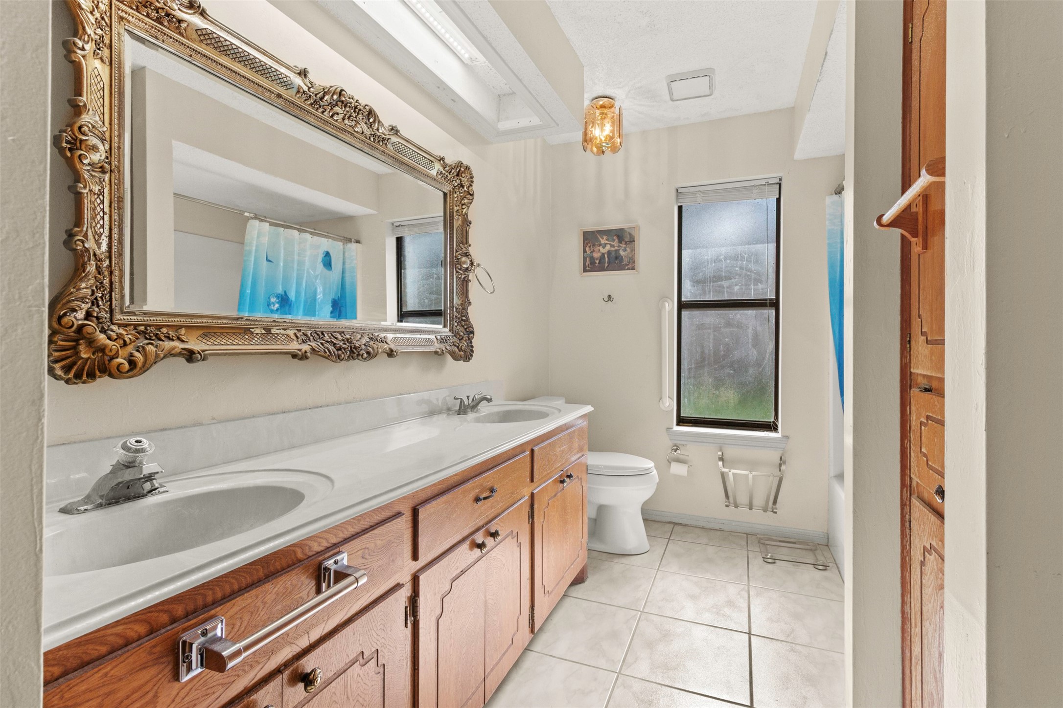 206 Stanford Road Lake Jackson, TX 77566 - Photo 14 of 26 a bathroom with a sink and a mirror