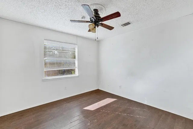 a view of room with ceiling fan