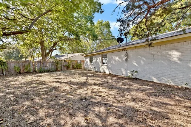 a view of a house with a tree