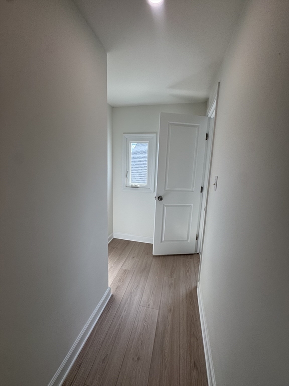 16 Cottage Street, Unit 2 Lynn, MA 01905 - Photo 13 of 25 a view of a hallway with wooden floor