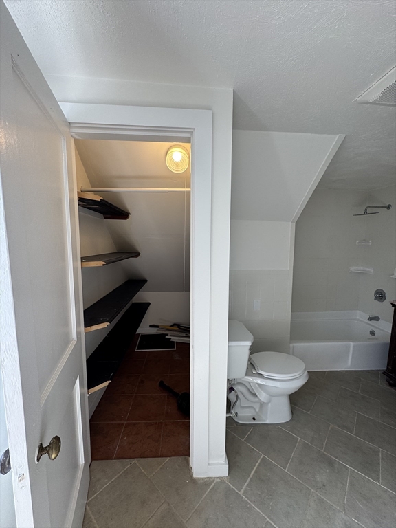 16 Cottage Street, Unit 2 Lynn, MA 01905 - Photo 16 of 25 a bathroom with a toilet a sink and a shower