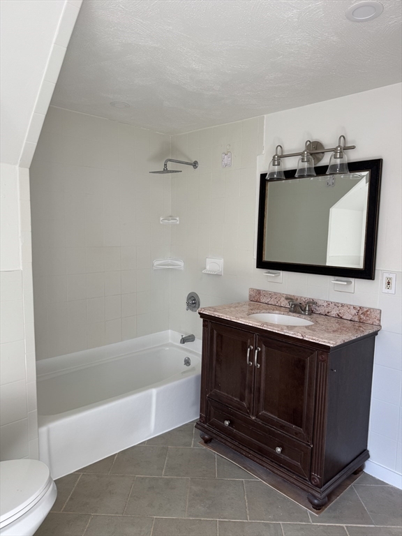 16 Cottage Street, Unit 2 Lynn, MA 01905 - Photo 17 of 25 a bathroom with a sink and a bathtub