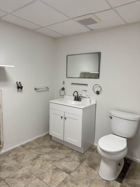 16 Cottage Street, Unit 2 Lynn, MA 01905 - Photo 22 of 25 a bathroom with a toilet sink and mirror