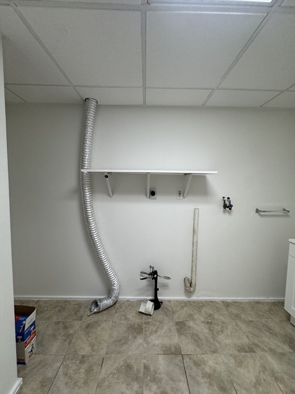 16 Cottage Street, Unit 2 Lynn, MA 01905 - Photo 24 of 25 a view of a room with racks on the wall