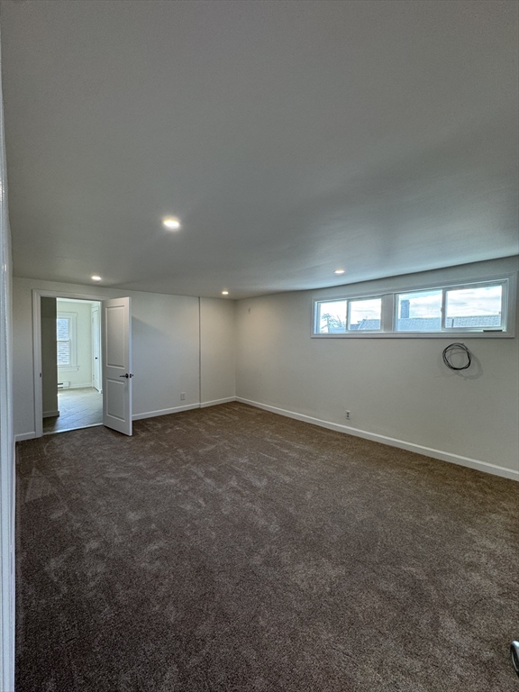 16 Cottage Street, Unit 2 Lynn, MA 01905 - Photo 4 of 25 an empty room with window and mirror in it