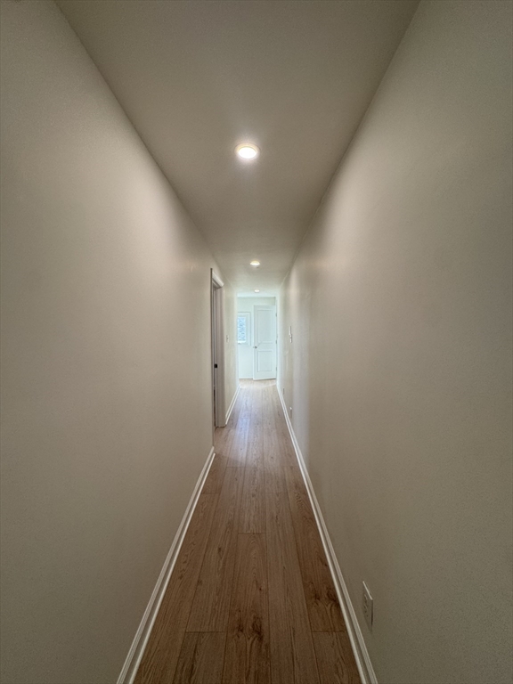 16 Cottage Street, Unit 2 Lynn, MA 01905 - Photo 9 of 25 a view of hallway with wooden floor