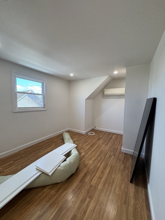 16 Cottage Street, Unit 2 Lynn, MA 01905 - Photo 10 of 25 a view of a room with wooden floor and stairs