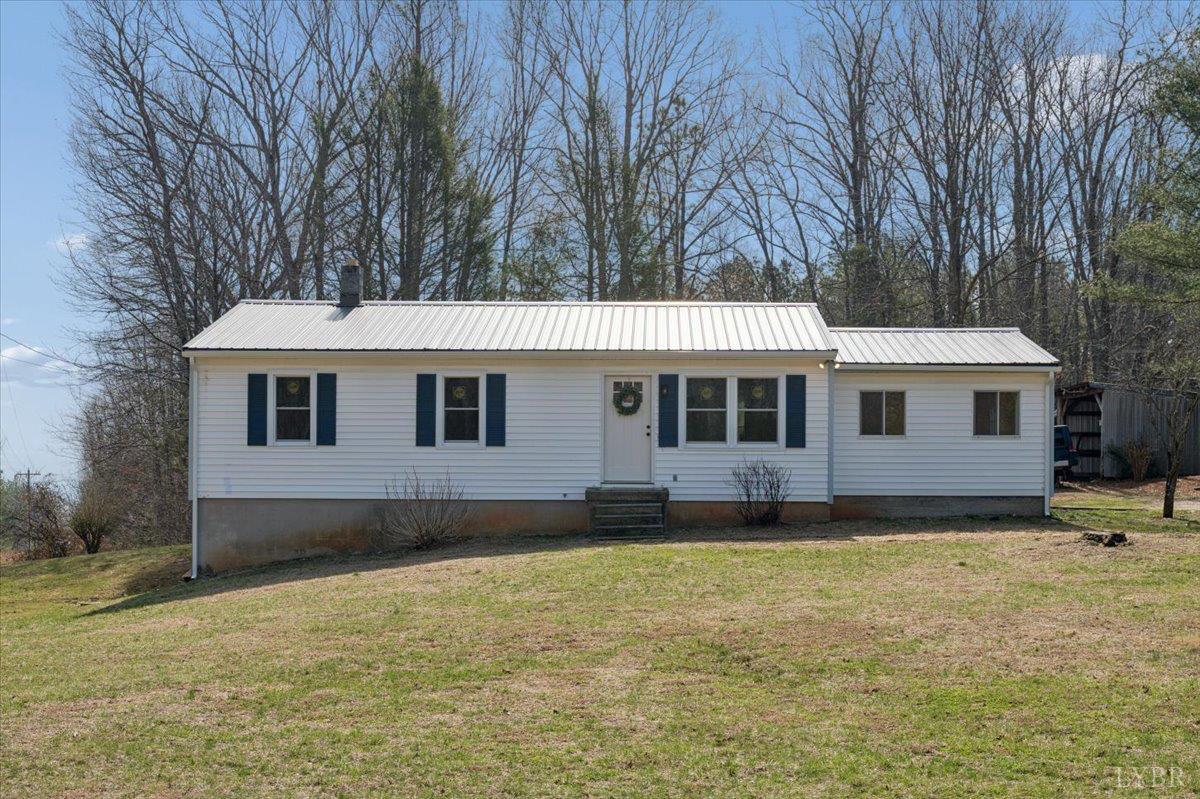146 Watts Mill Road Pamplin, VA 23958 - Photo 1 of 37 a front view of a house with a yard