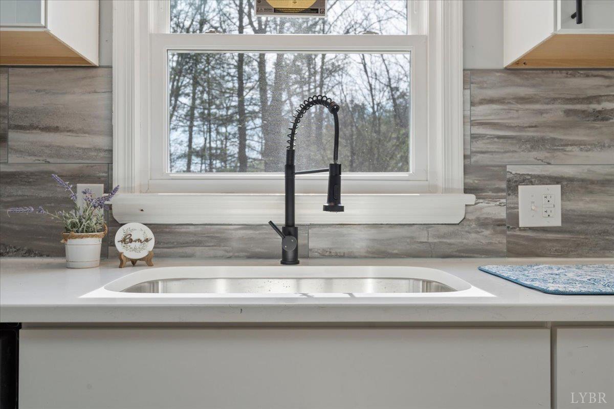 146 Watts Mill Road Pamplin, VA 23958 - Photo 11 of 37 a kitchen with a sink and a window