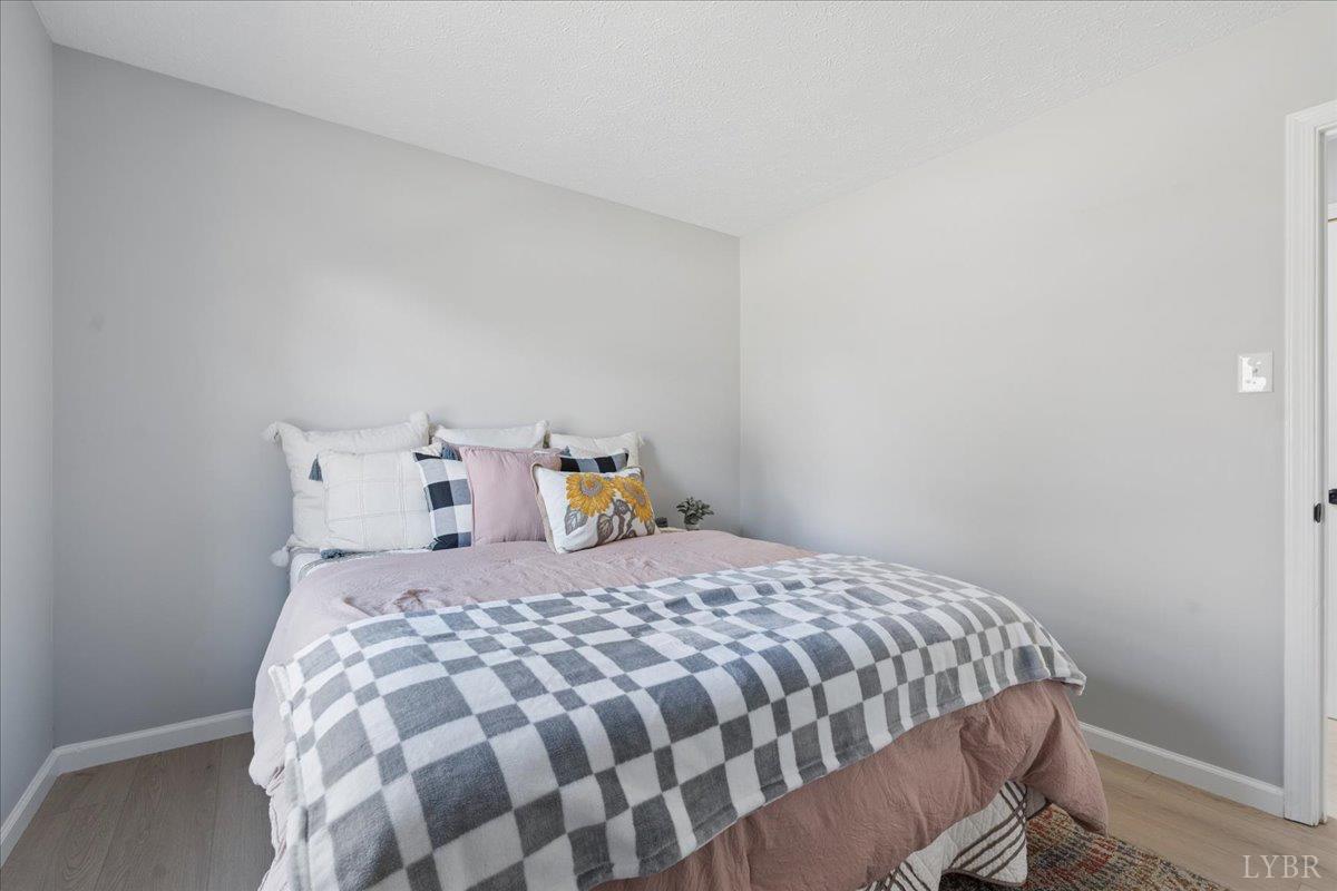 146 Watts Mill Road Pamplin, VA 23958 - Photo 15 of 37 a bedroom with a bed and window