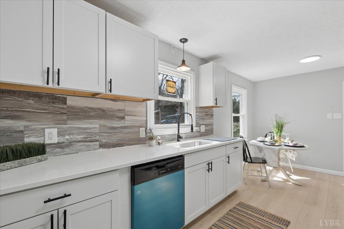 146 Watts Mill Road Pamplin, VA 23958 - Photo 21 of 37 a kitchen with a sink cabinets and wooden floor