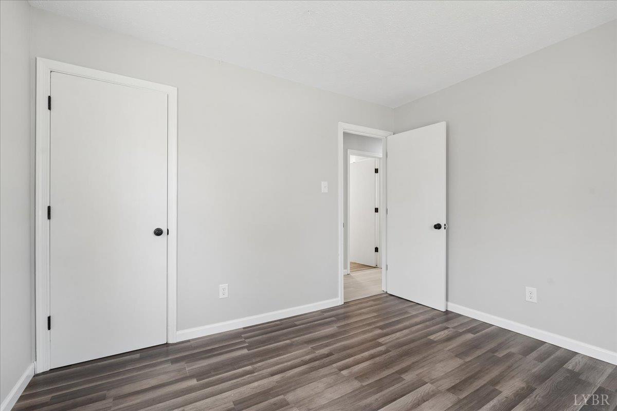 146 Watts Mill Road Pamplin, VA 23958 - Photo 29 of 37 a view of an empty room with wooden floor