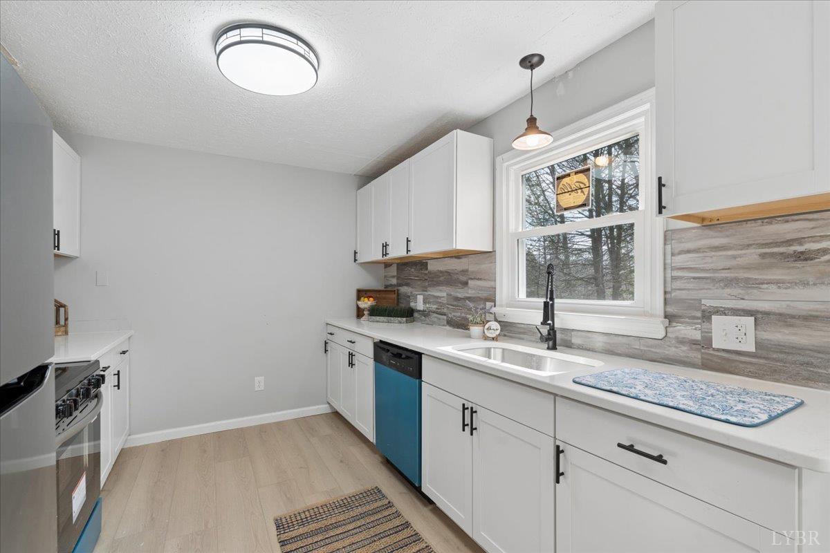 146 Watts Mill Road Pamplin, VA 23958 - Photo 3 of 37 a kitchen with a sink cabinets and window