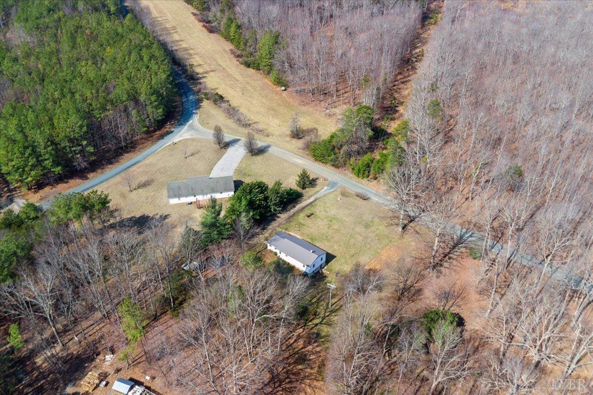 146 Watts Mill Road Pamplin, VA 23958 - Photo 33 of 37 a view of a yard with plants and wooden fence
