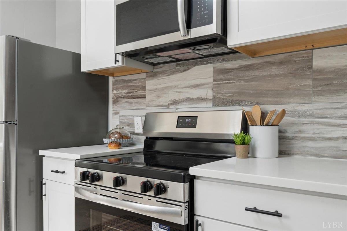 146 Watts Mill Road Pamplin, VA 23958 - Photo 10 of 37 a stove top oven sitting inside of a kitchen