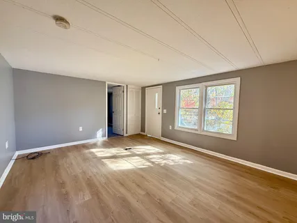 a view of an empty room with a window
