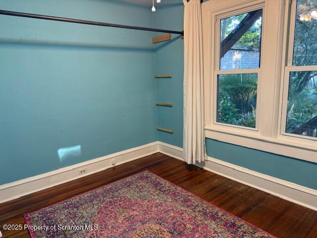 1034 Fairfield Street, Unit 1 Scranton, PA 18509 - Photo 3 of 6 a view of empty room with window and wooden floor