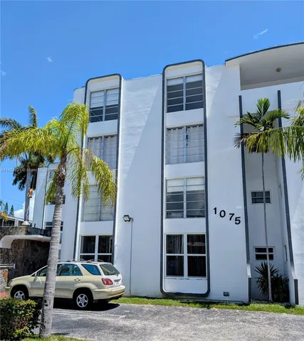 a car parked in front of a building