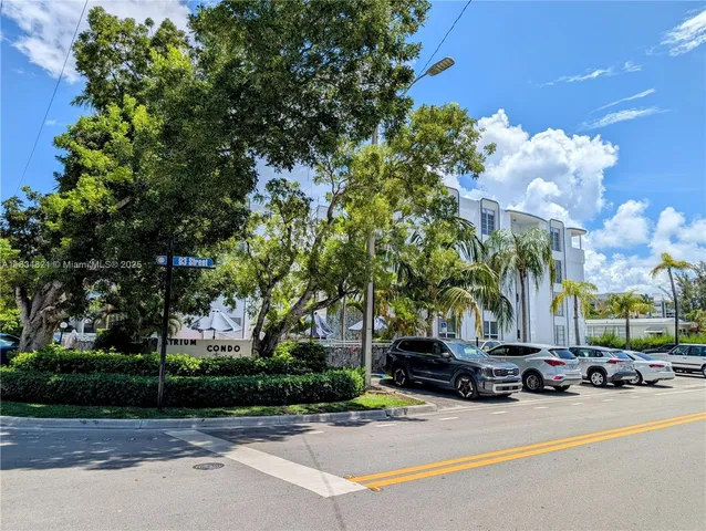 a view of a street with houses on both side