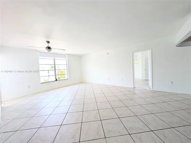 a view of an empty room and window