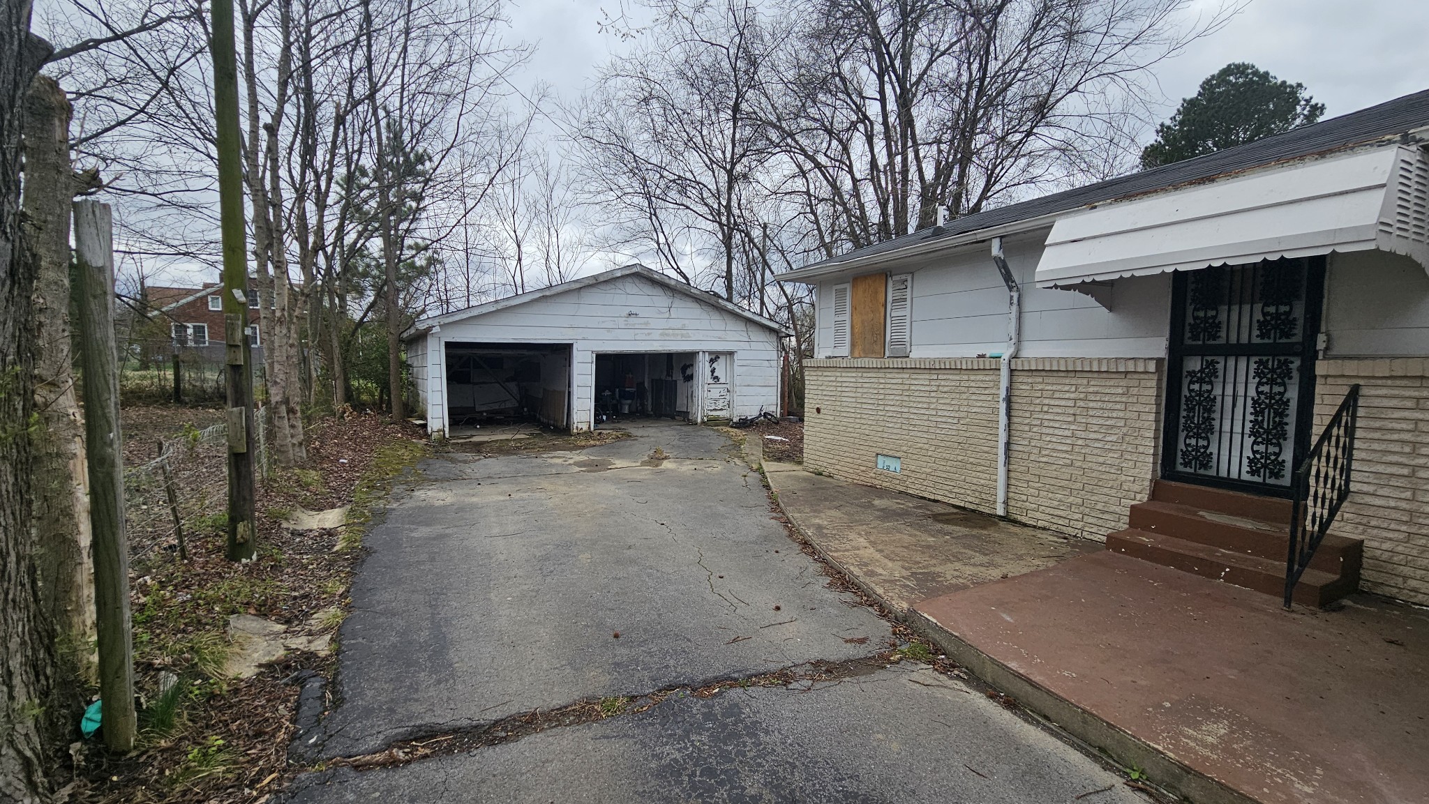 104 West 21st Avenue Springfield, TN 37172 - Photo 5 of 7 a view of a house with a yard and garage
