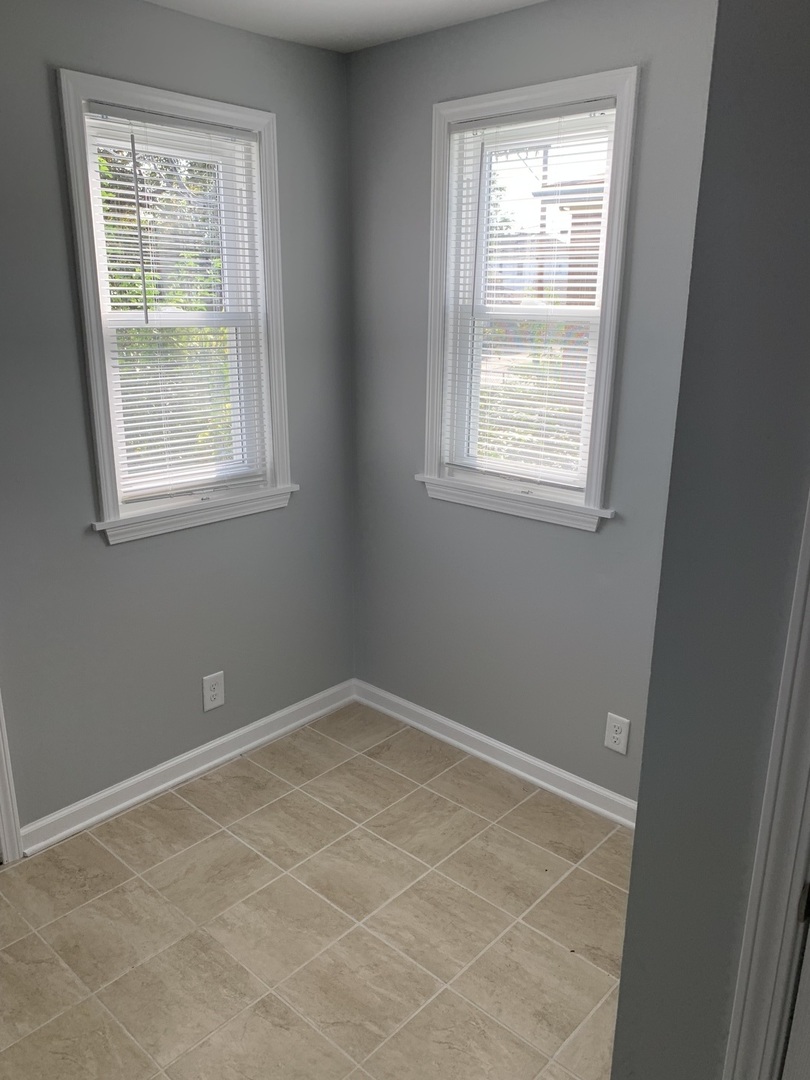 7555 West 63rd Place Summit, IL 60501 - Photo 11 of 19 an empty room with a window