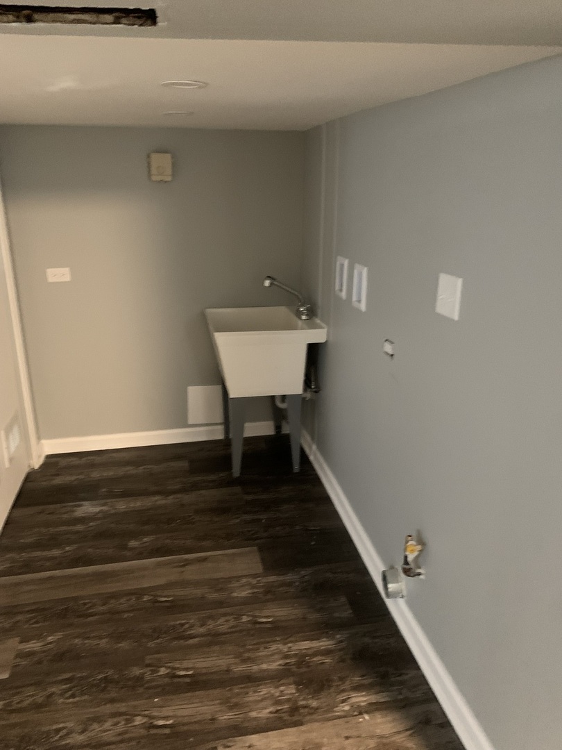 7555 West 63rd Place Summit, IL 60501 - Photo 16 of 19 a view of a hallway with wooden floor and staircase