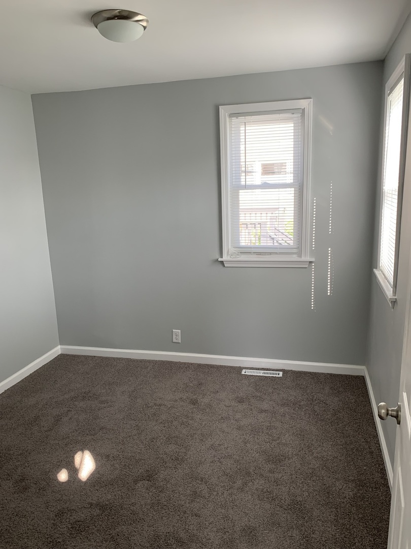 7555 West 63rd Place Summit, IL 60501 - Photo 10 of 19 an empty room with windows