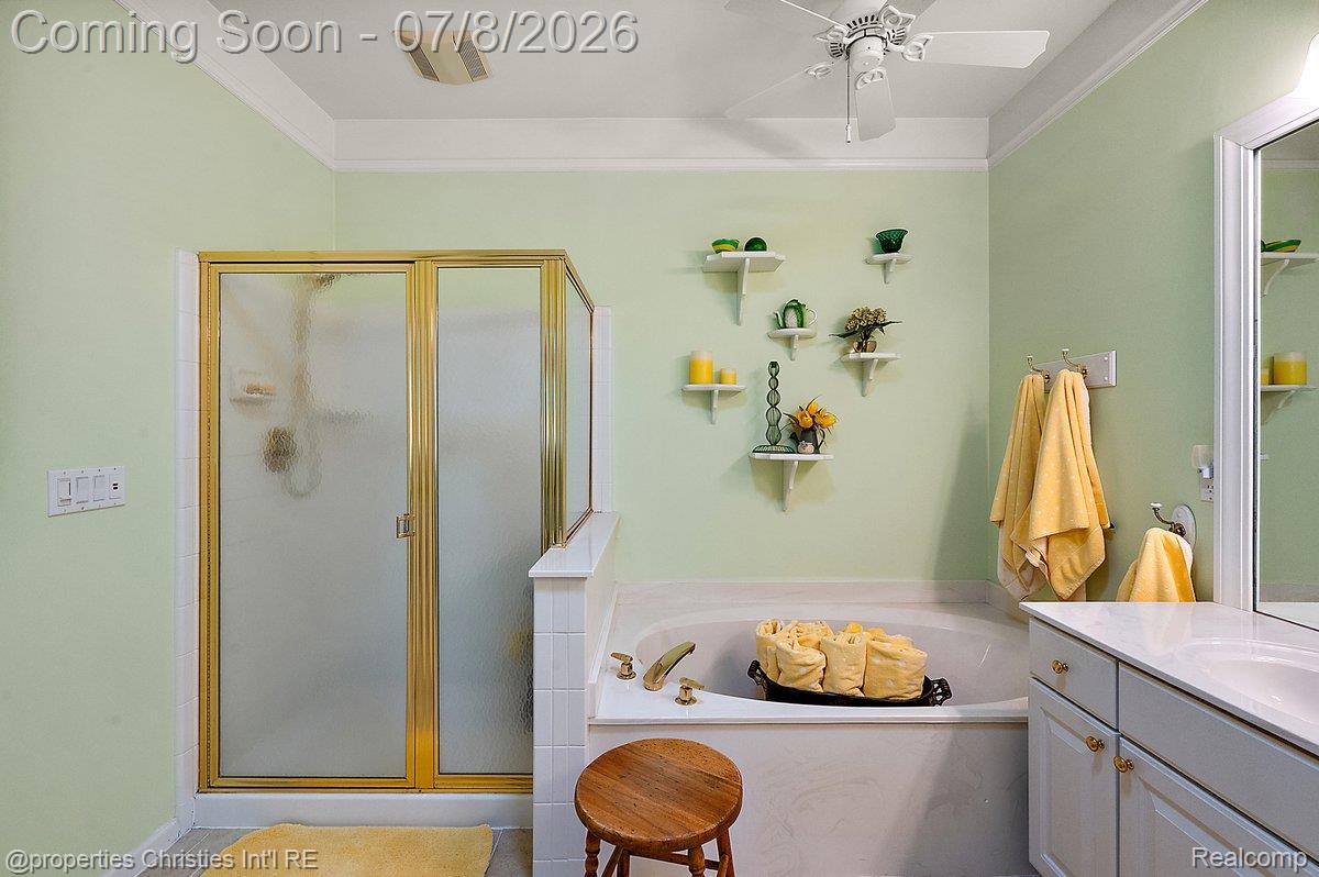 1946 Dunham Drive Rochester, MI 48306 - Photo 27 of 38 Bathroom featuring a built-in tub, a separate shower and double vanity