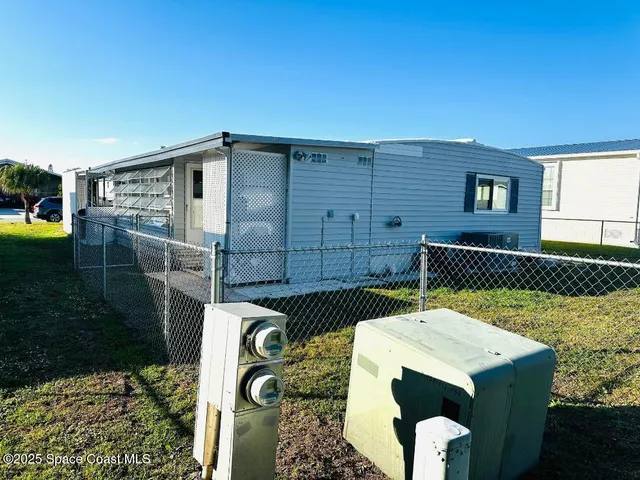a view of a backyard with plants and lake view