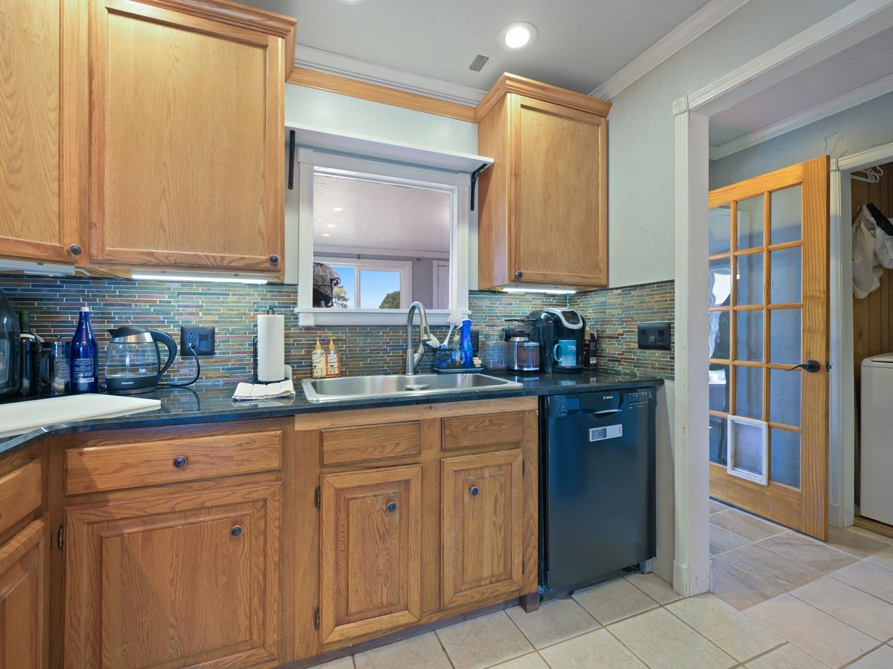 6777 Reeder Mesa Road Whitewater, CO 81527 - Photo 11 of 42 a kitchen with white cabinets and a sink